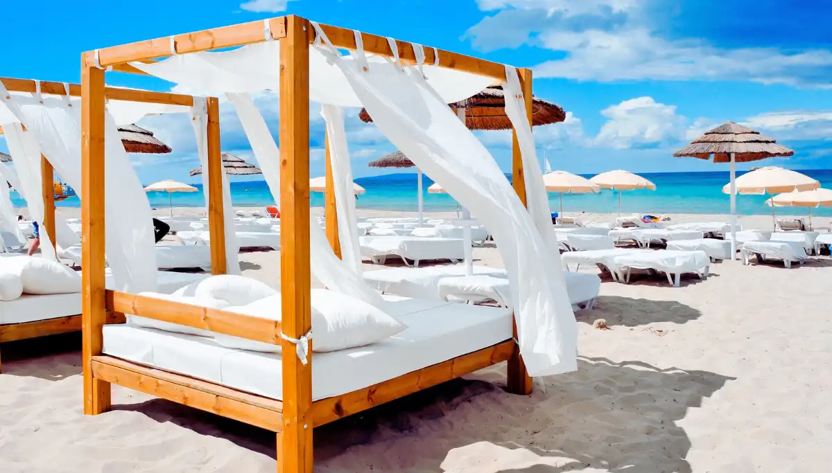 Sun loungers and parasols arranged on a beach club terrace in Marbella