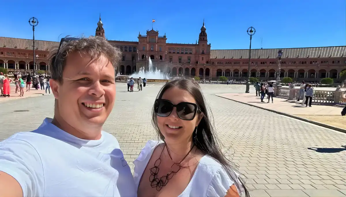 Couple rowing a boat on the canal at Plaza de España in Seville