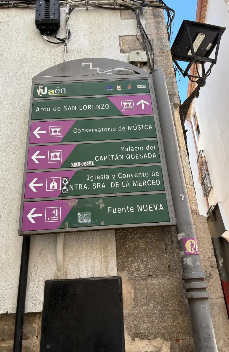 Jaén tourist signpost pointing to historic centre attractions including the cathedral and Arab baths