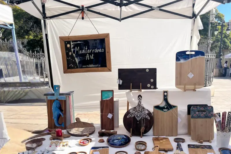 Handmade craft stall at the Mercado Artesanal La Merced in Plaza de la Merced, Malaga