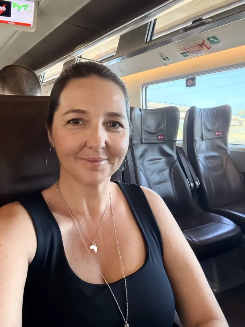 Heidi taking a selfie in her seat on an Iryo high-speed train