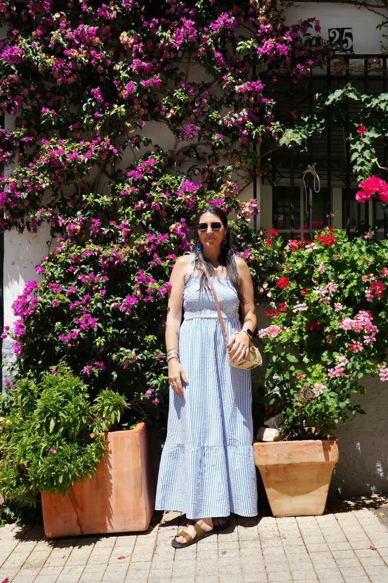 Heidi standing under bougainvillea in Marbella Old Town