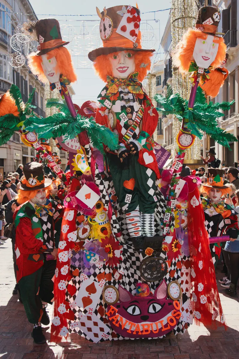 Giant decorative Fallas figures towering over a square during the Las Fallas festival in Spain