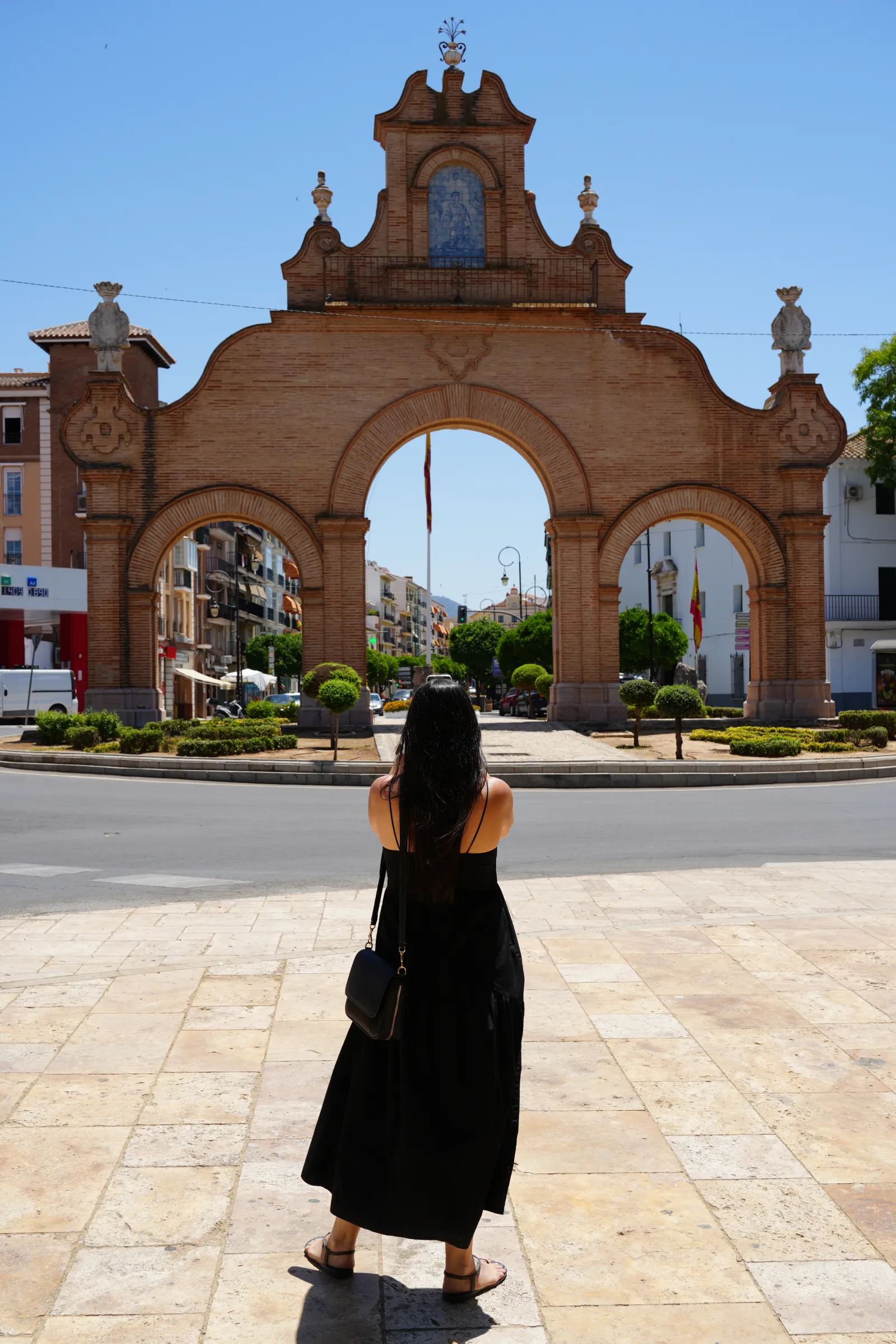 heidi standing in front of the antequera landmark next to the bullring