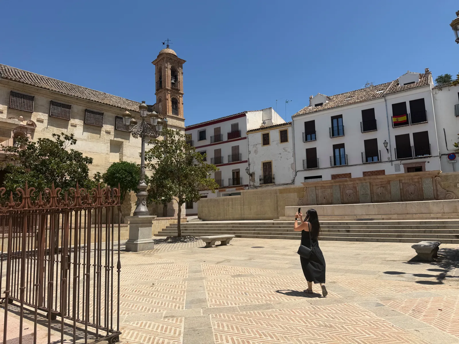 Heidi walking across Plaza Coso Viejo in Antequera's old town