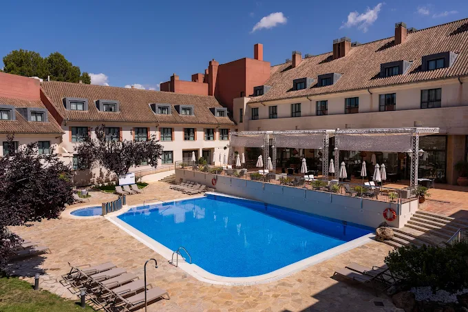 The outdoor pool and terrace at Hotel Antequera Golf resort near Antequera
