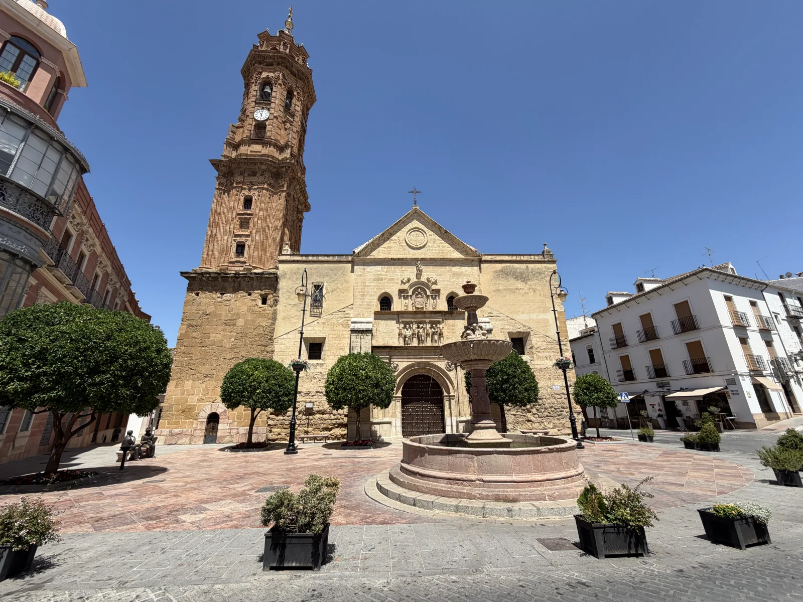 Plaza de San Sebastián in Antequera with its fountain and the baroque bell tower of the church