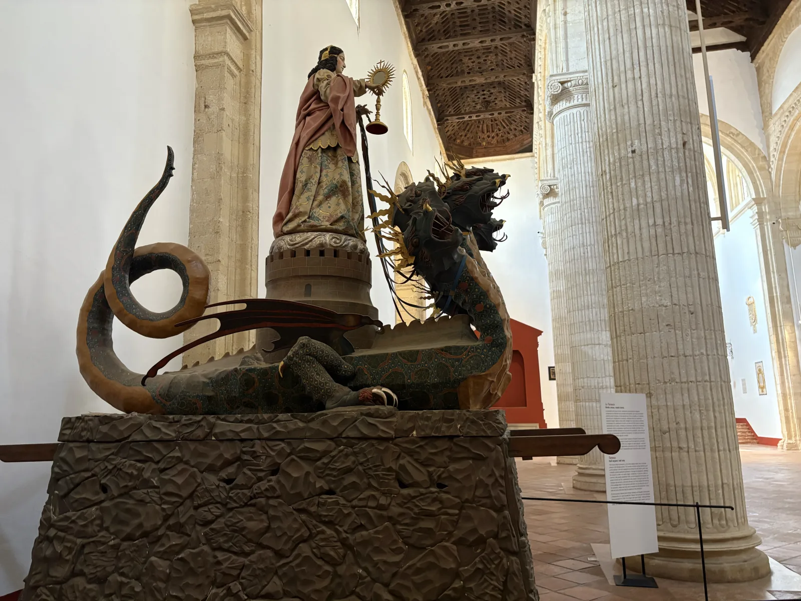 The Tarasca, a half-serpent half-woman figure mounted on a many-headed dragon, on display inside the Colegiata in Antequera