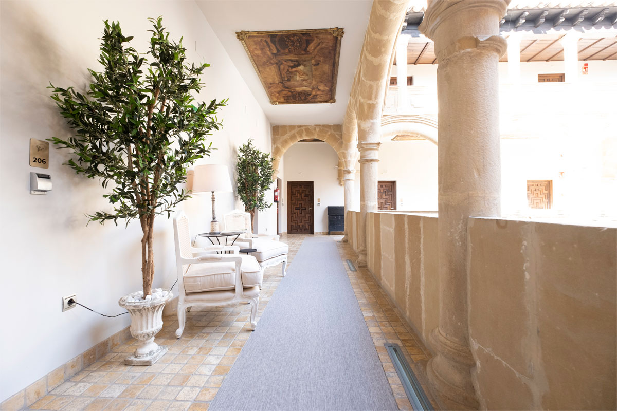 Hotel Palacio de los Salcedo stone courtyard inside a restored historic palace in Baeza