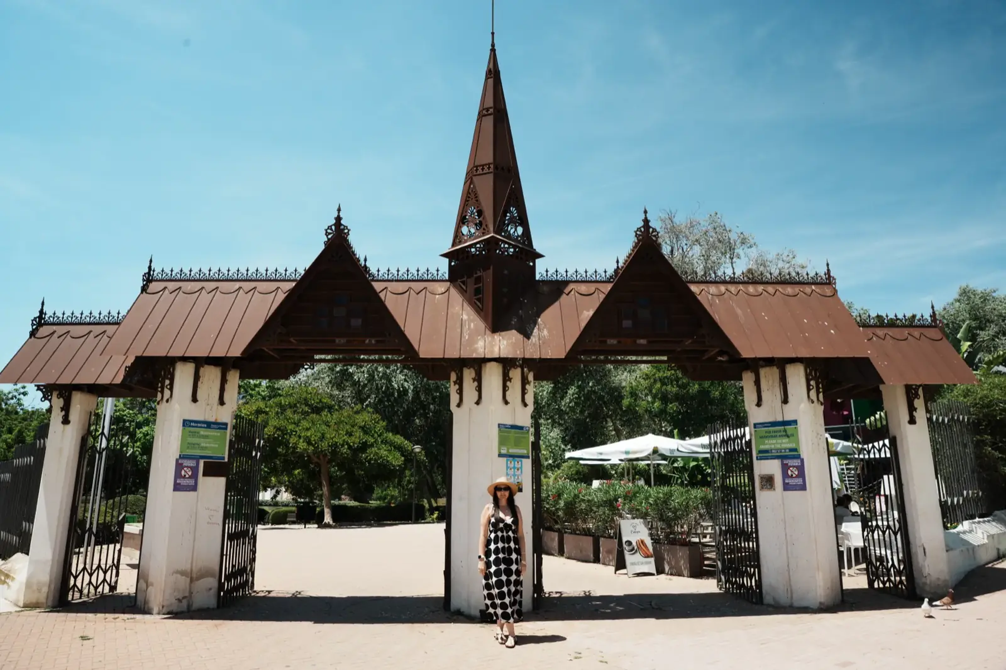 Woman posing at the entrance to Parque de la Paloma in Benalmádena
