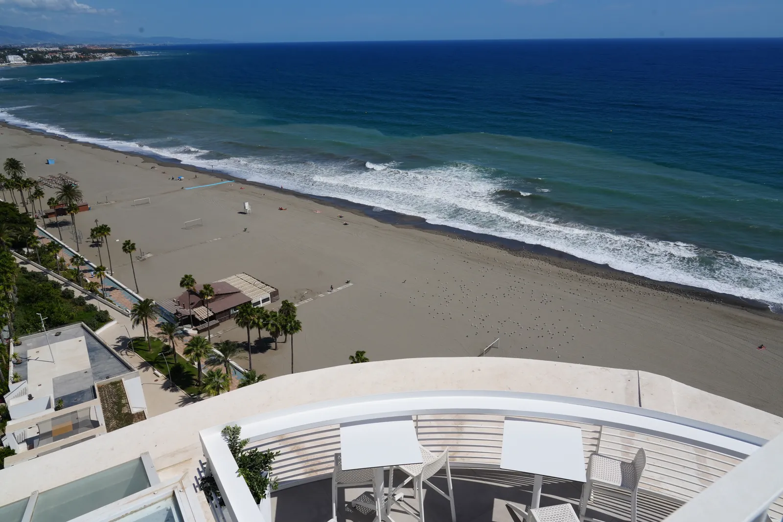 Aerial view of waves along Estepona's coastline