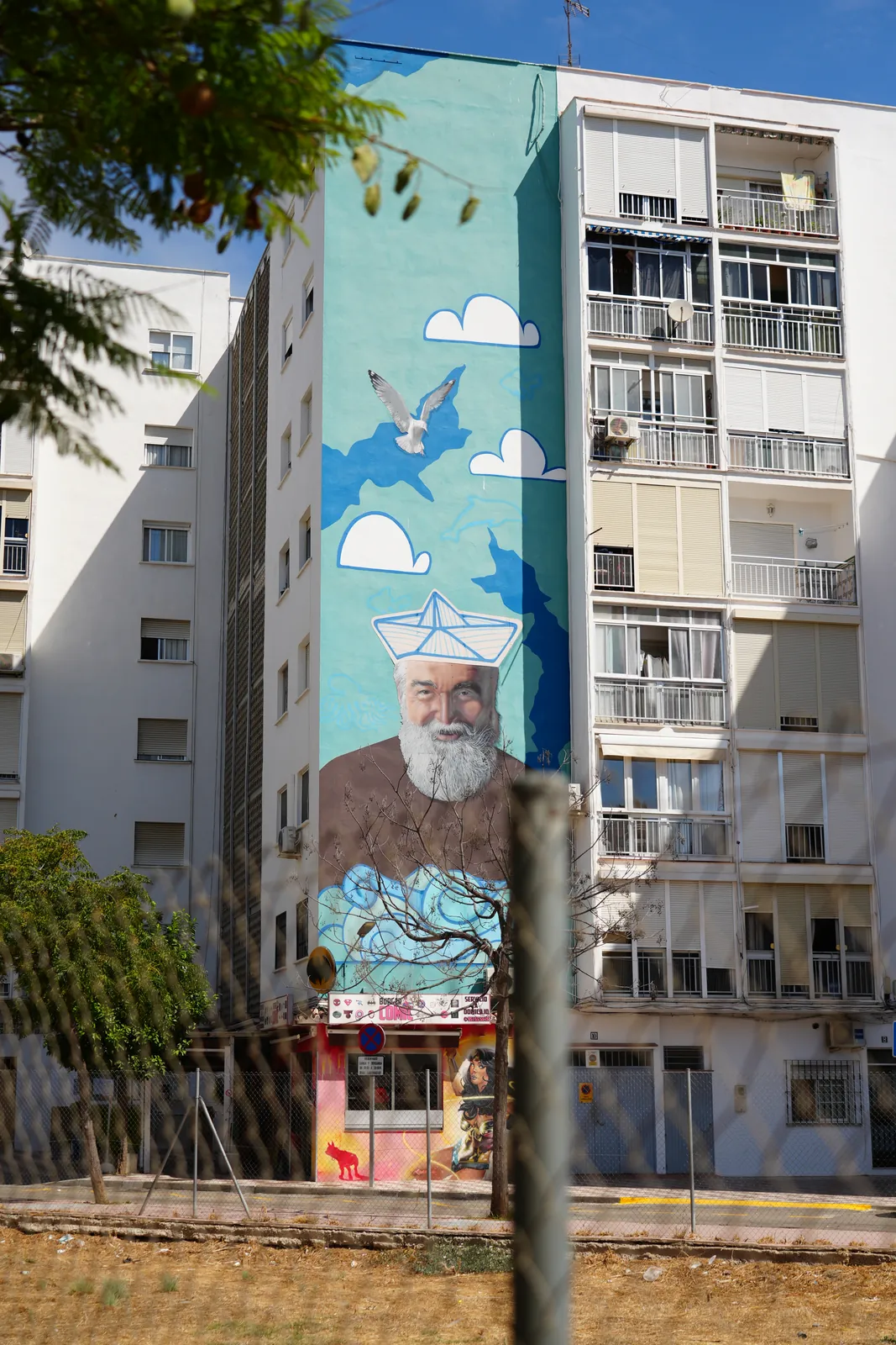 Bearded sailor mural with a paper-boat hat in Estepona