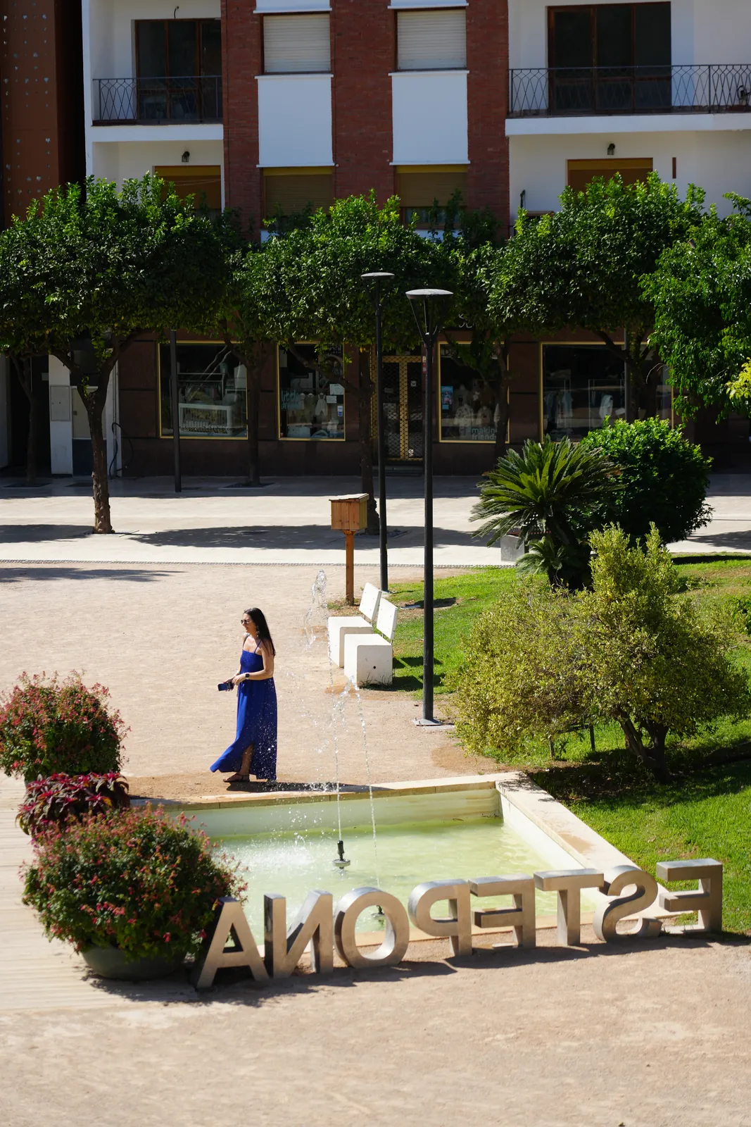Fountain plaza with giant steel letters spelling ESTEPONA, part of the Orchidarium gardens