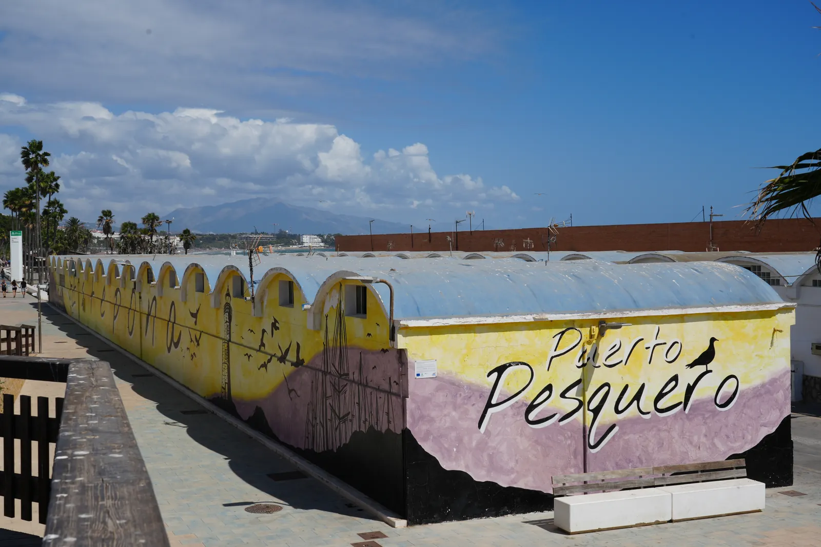 Puerto Pesquero mural wrapping the old fish market building on the Estepona seafront