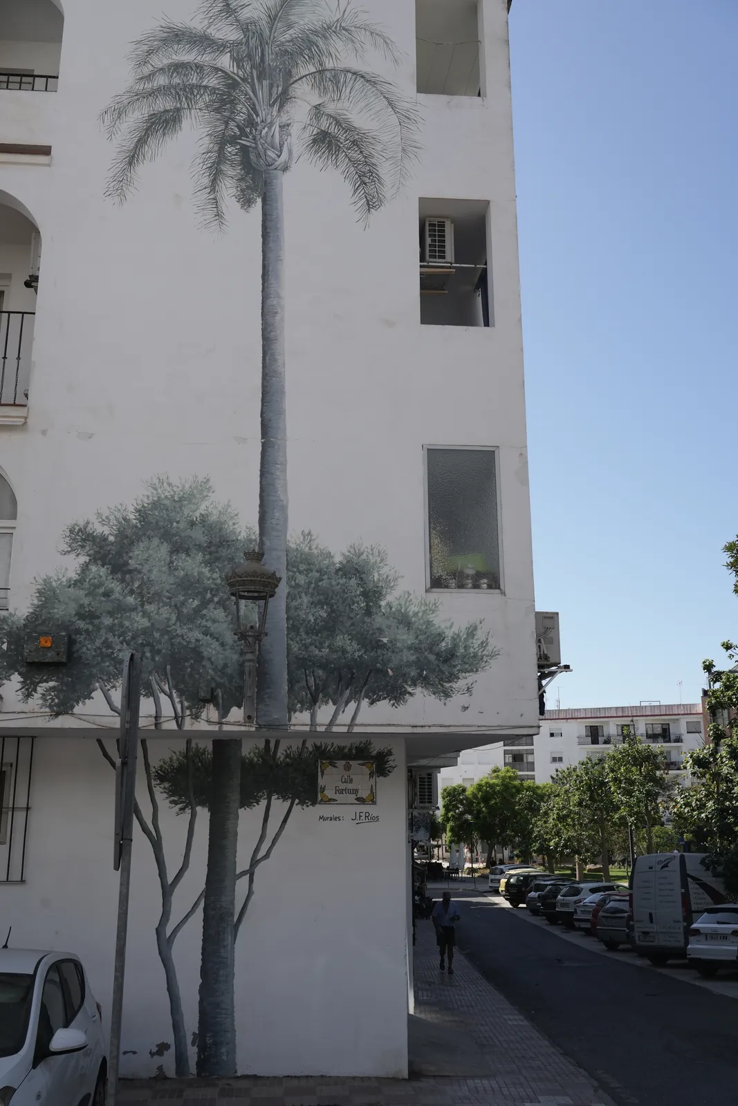 Photorealistic palm tree mural on Calle Fortuny in Estepona