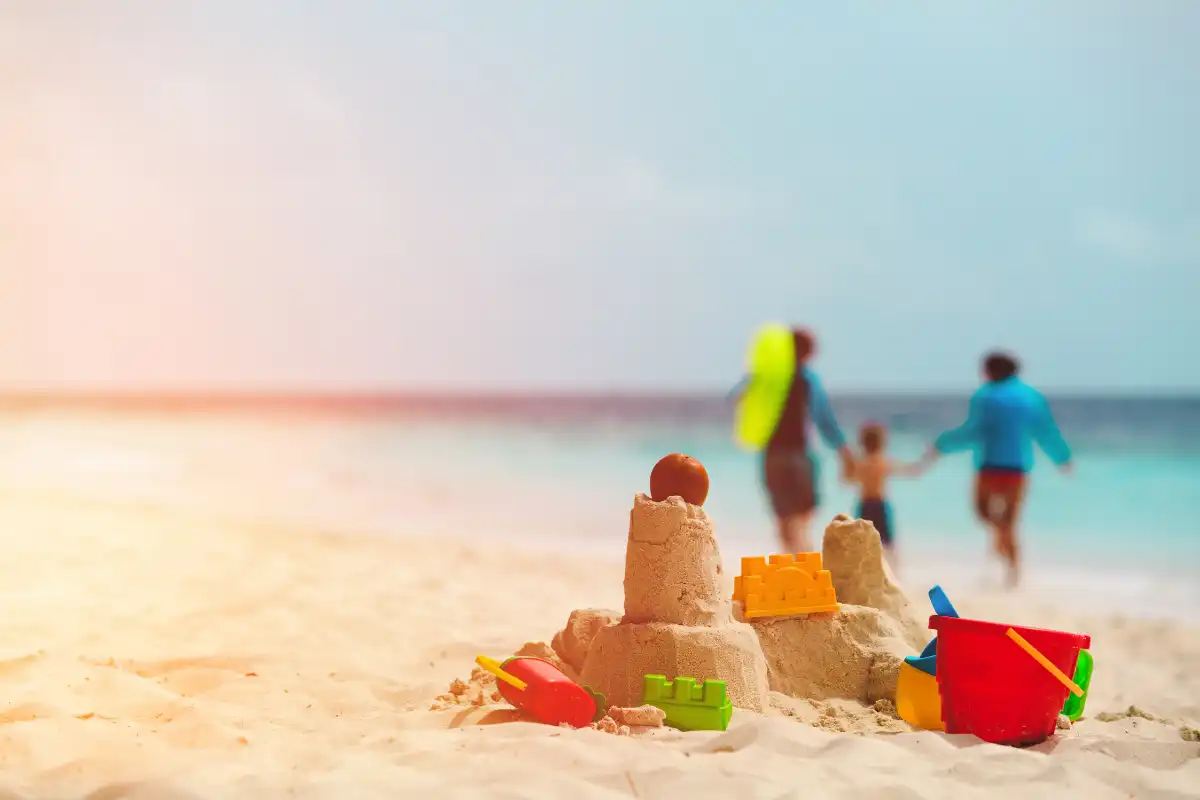 Family building sandcastles on the beach