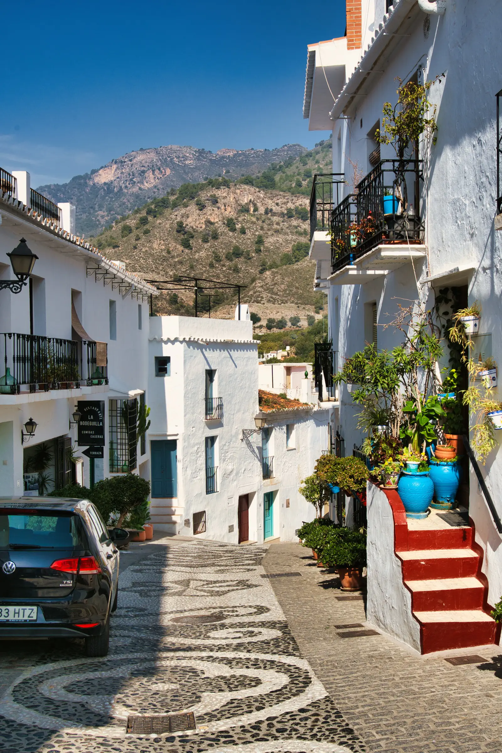 Colourful street in Frigiliana during autumn