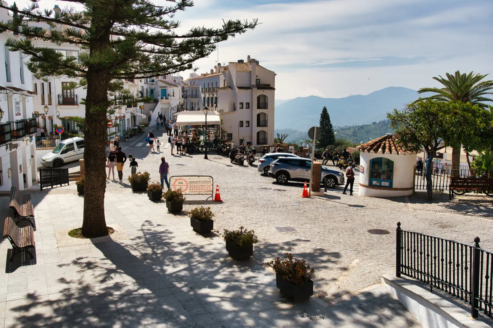 Whitewashed buildings and flower pots in the centre of Frigiliana village