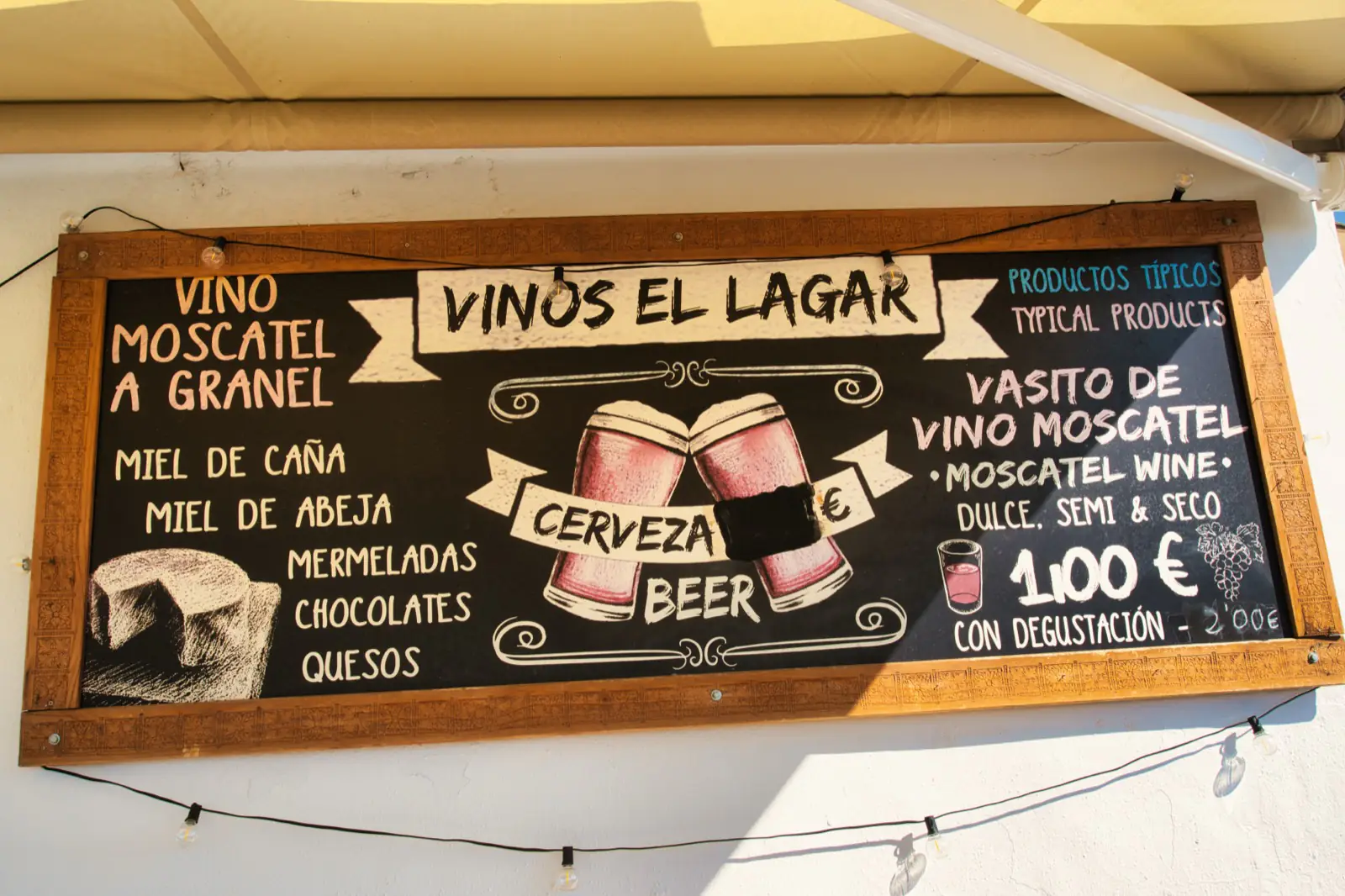 Wine and food chalkboard menu outside a bodega in Frigiliana
