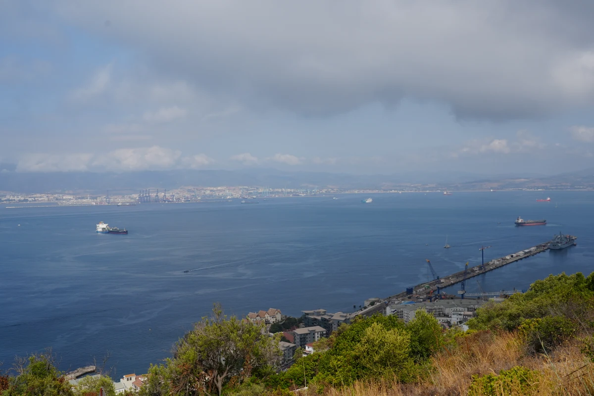 Panorama across Gibraltar bay with cargo ships anchored off the Spanish coast