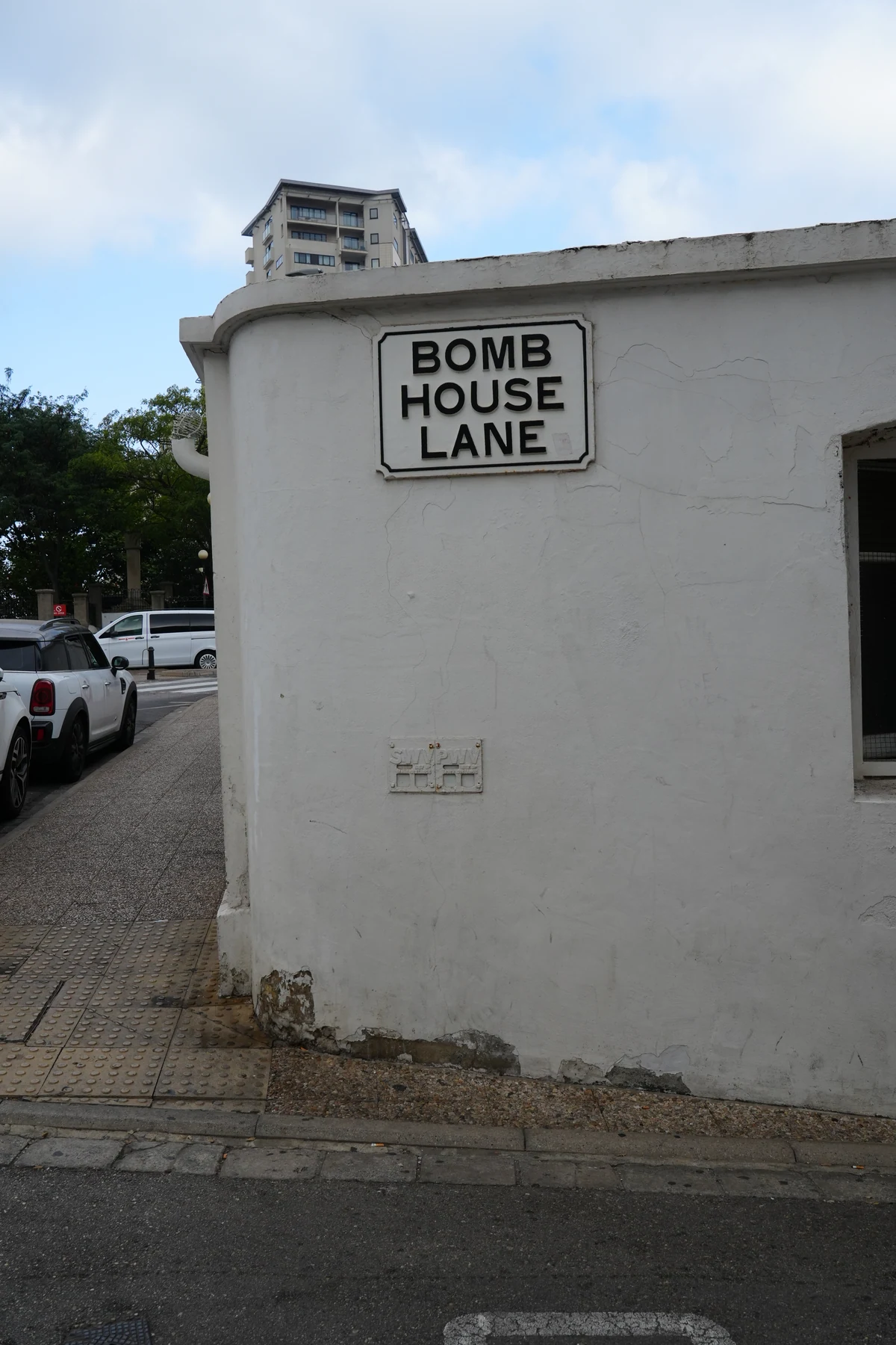 Bomb House Lane street sign on a wall in Gibraltar