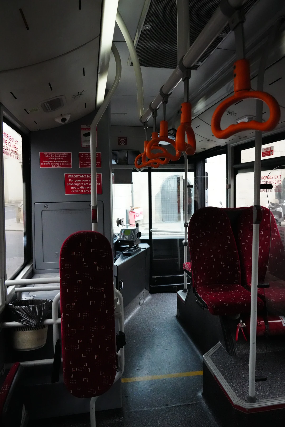 Red seats inside a Gibraltar public bus