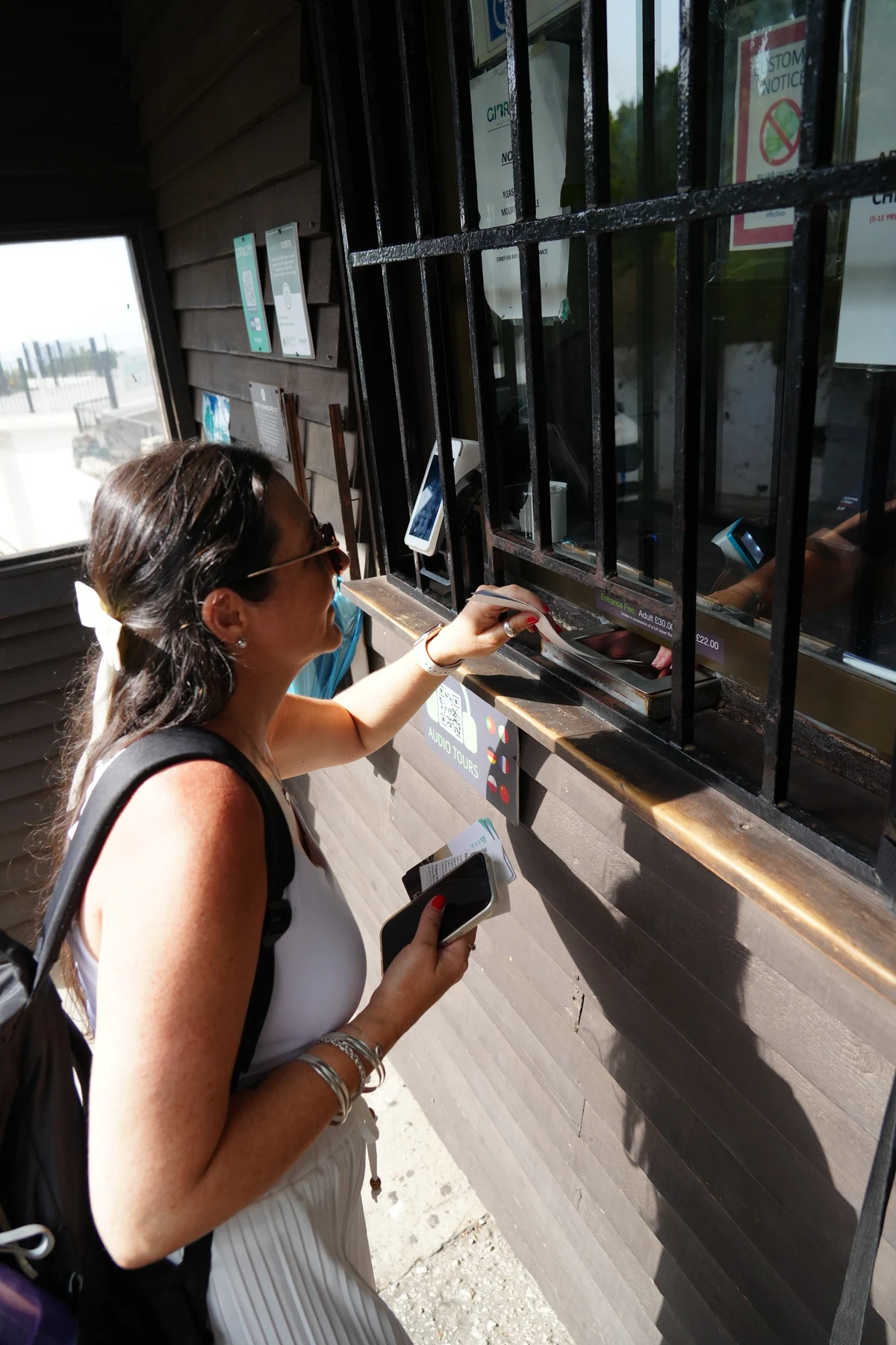 Buying an Upper Rock Nature Reserve ticket at the office in Gibraltar