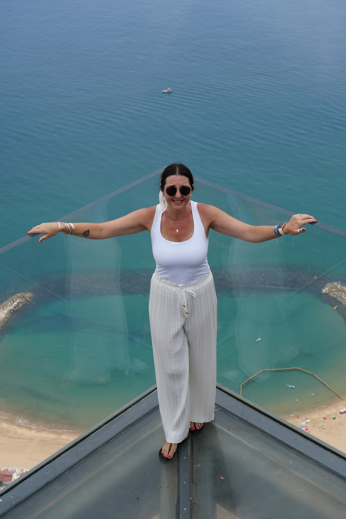 Standing on the glass floor of the Skywalk viewing platform in Gibraltar