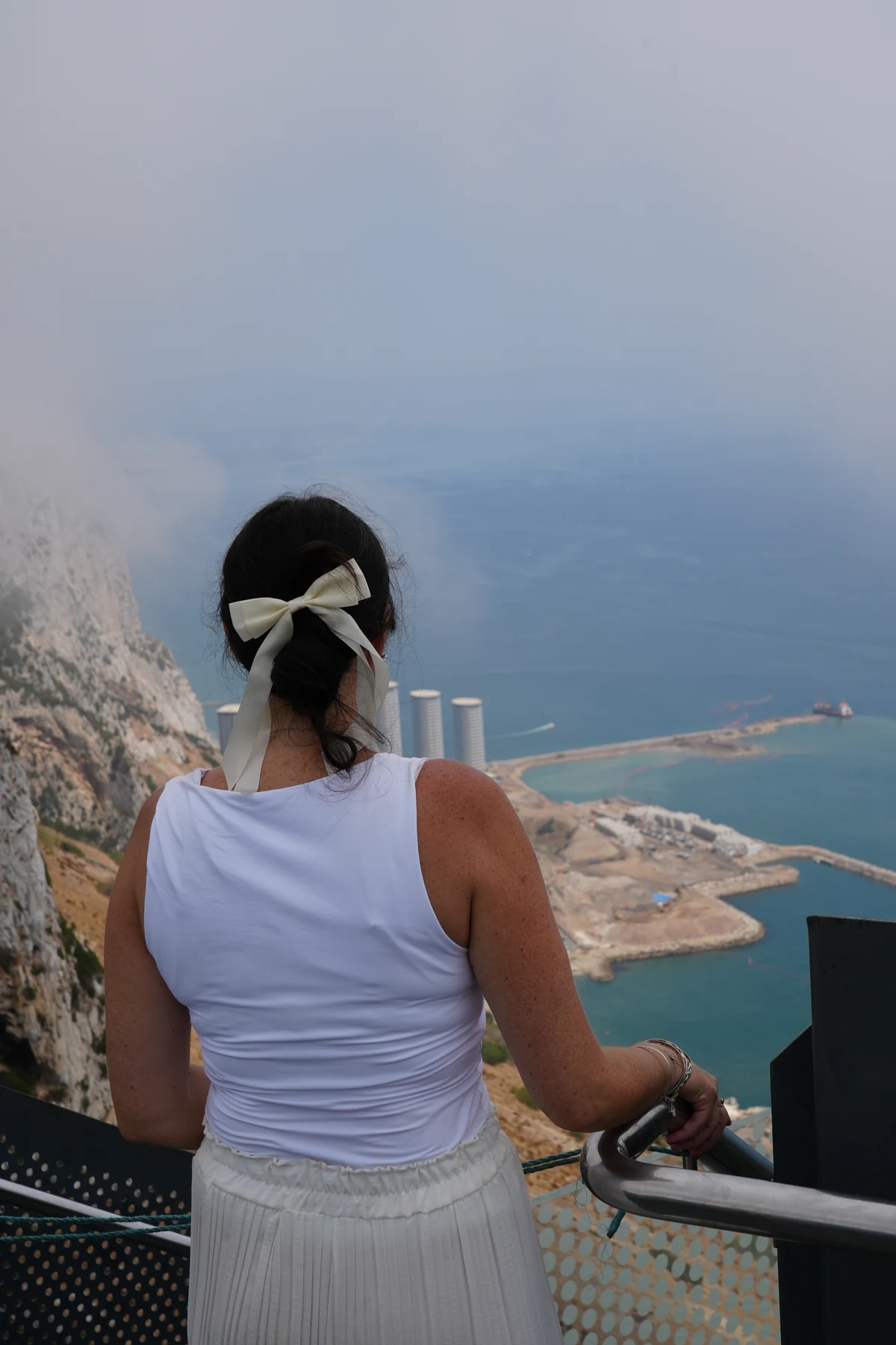 Standing at the Skywalk rail in Gibraltar with the view lost to levante mist