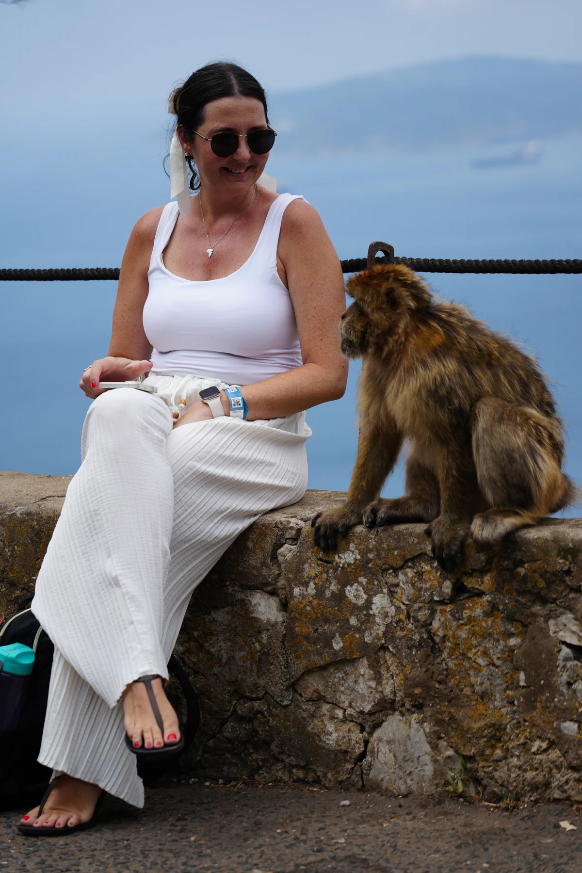 Heidi in Gibraltar sitting on a wall