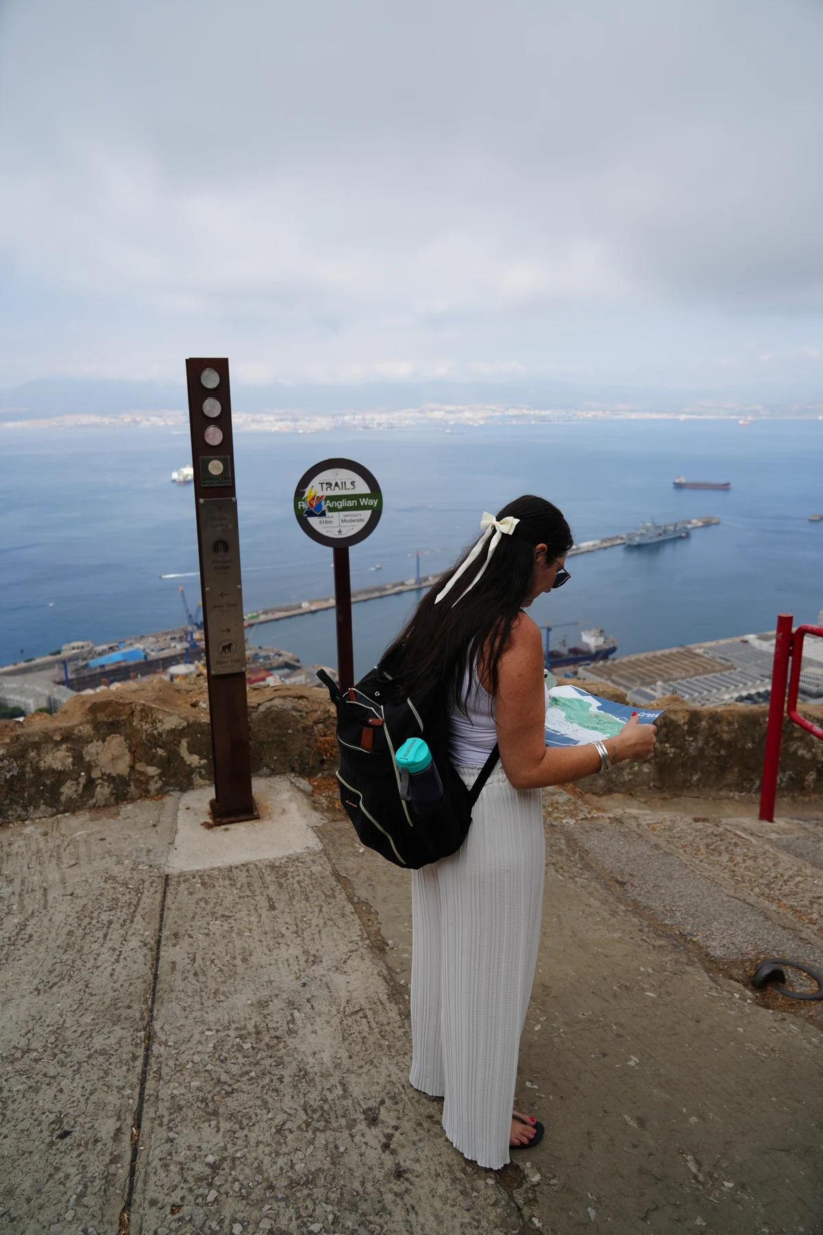 Reading a trail map board on the Rock above Gibraltar port