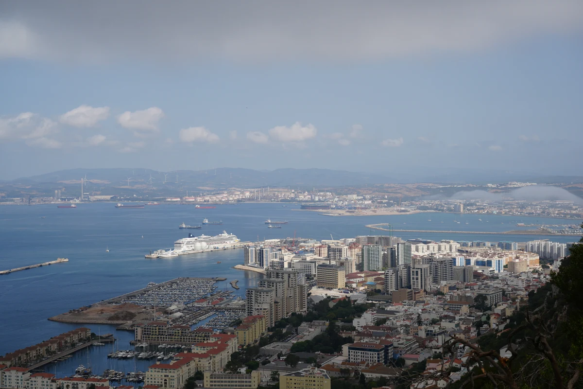 Panorama of Gibraltar town and marina with a cruise ship in port
