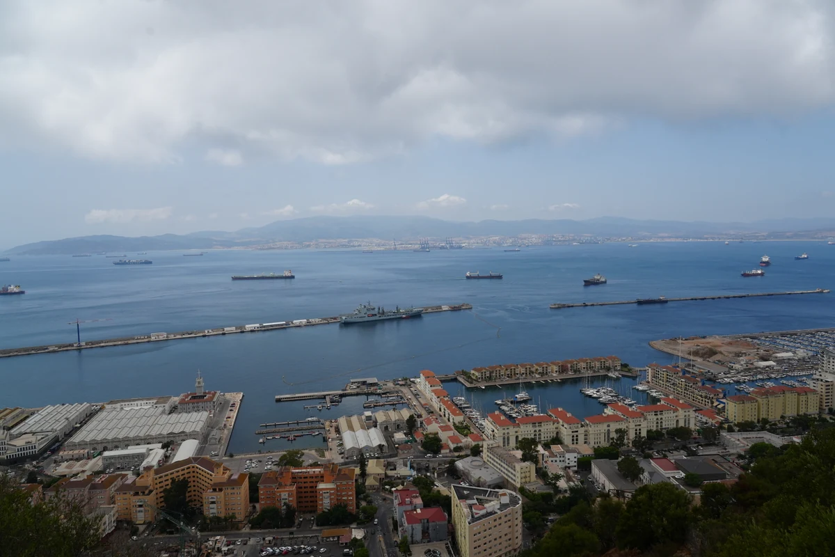 Panorama of the Gibraltar port and marina with a warship in dock