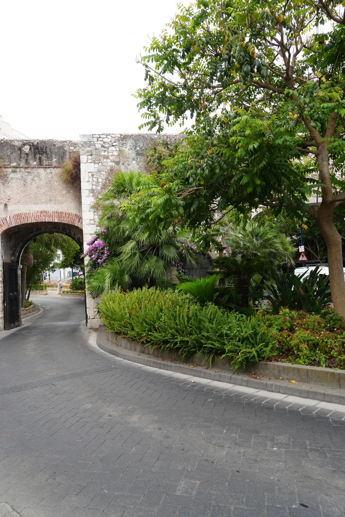 Road passing through an arch in the old city walls of Gibraltar