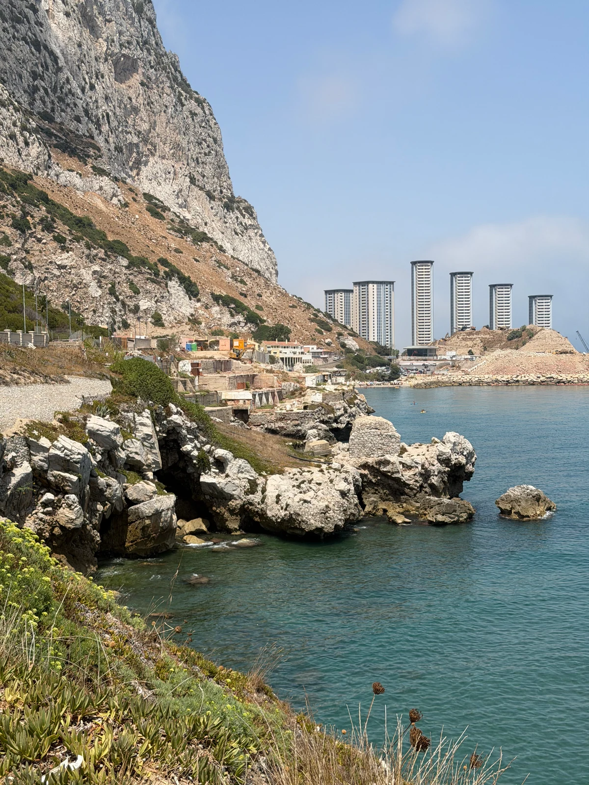 Rocky shoreline and apartment towers on the east side of Gibraltar