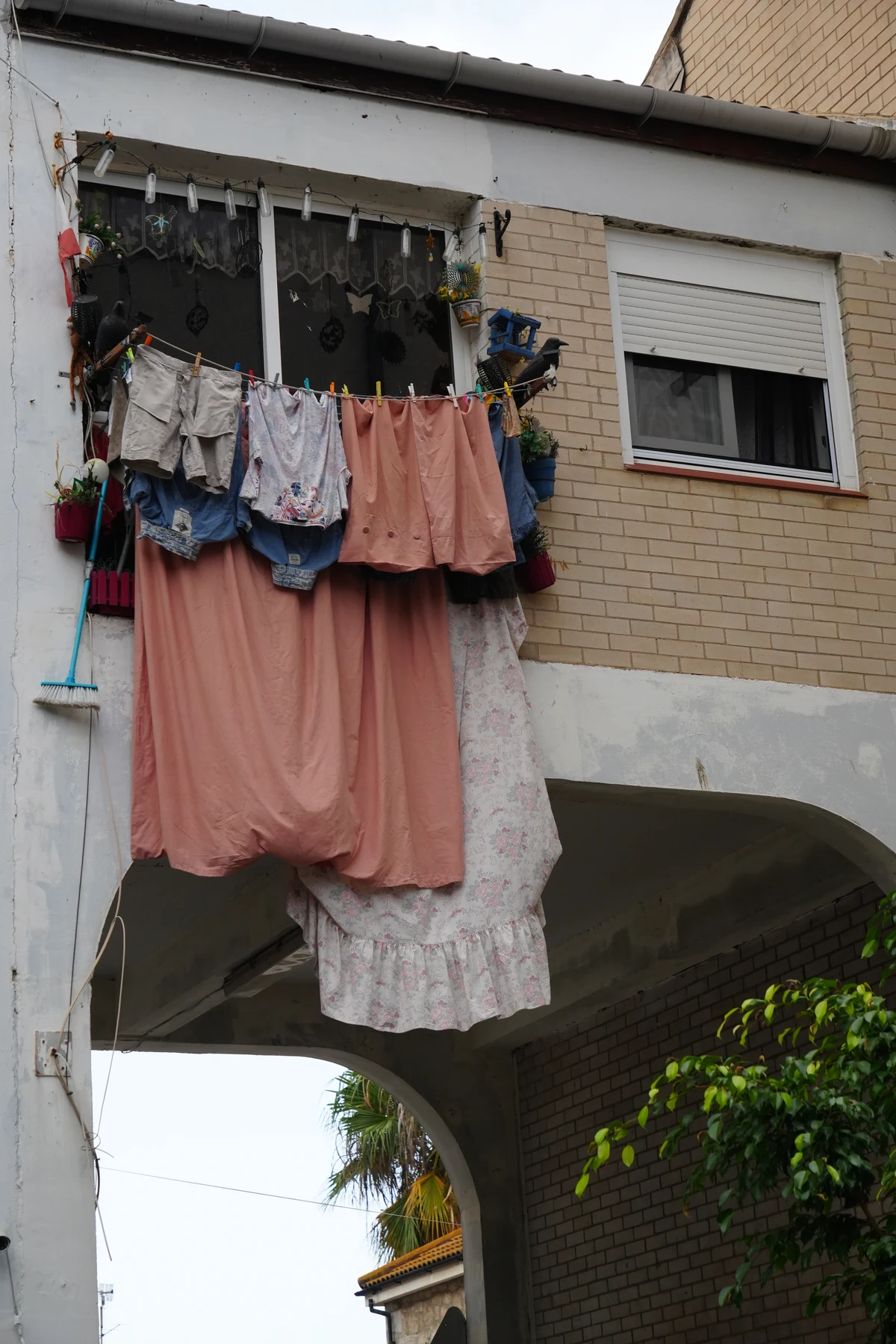Washing hung out over a balcony above a street in Gibraltar