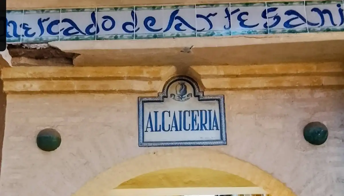 Narrow lane of the Alcaiceria market with ceramics and goods on display