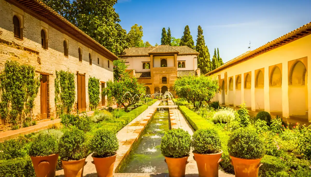Generalife garden terraces with fountains and cypress trees at the Alhambra