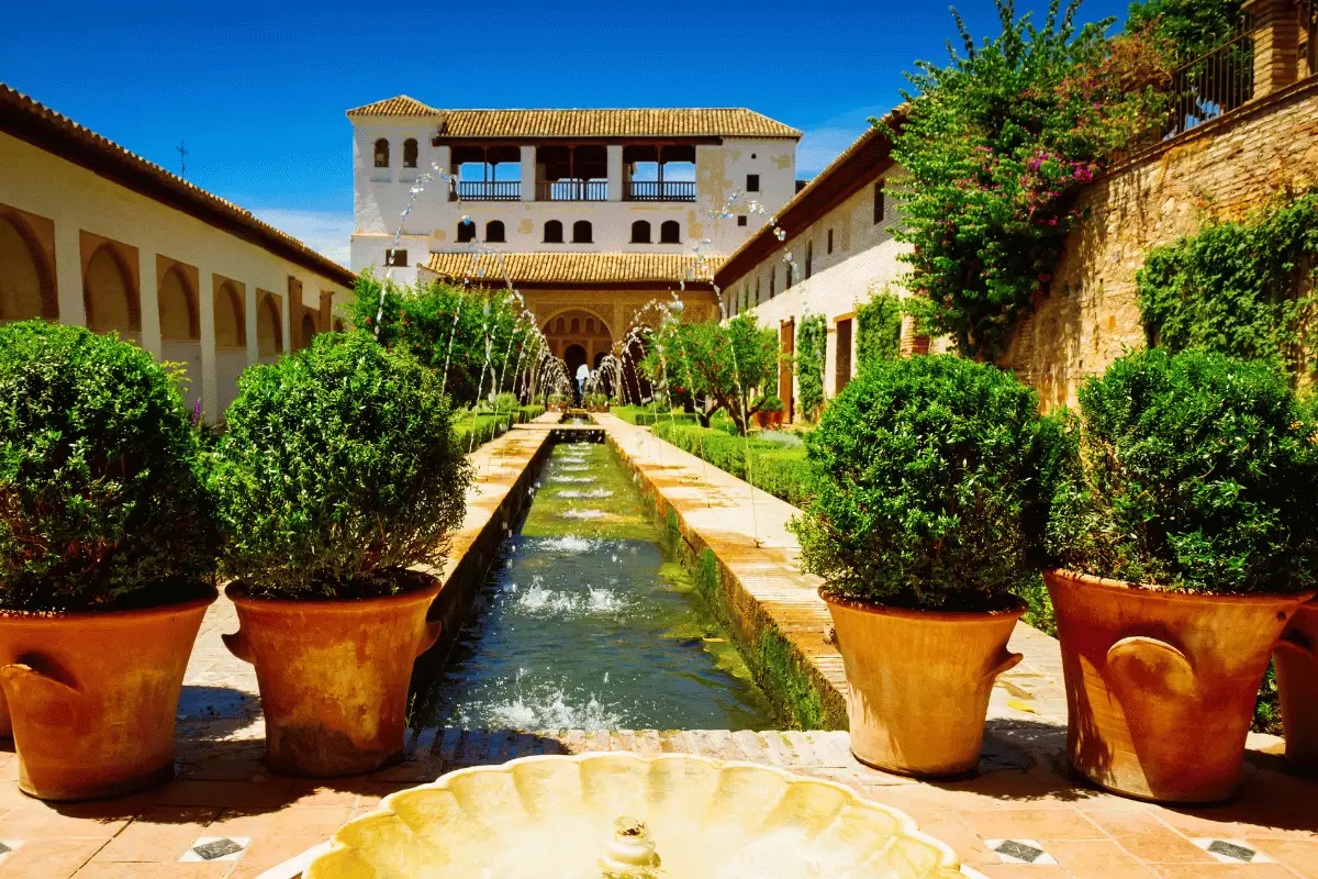 Water channel and formal gardens inside the Generalife palace at the Alhambra in Granada