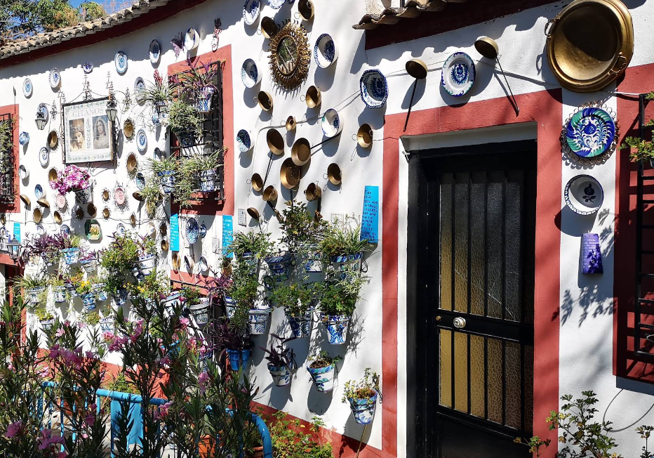 Whitewashed cave dwellings carved into the Sacromonte hillside above Granada