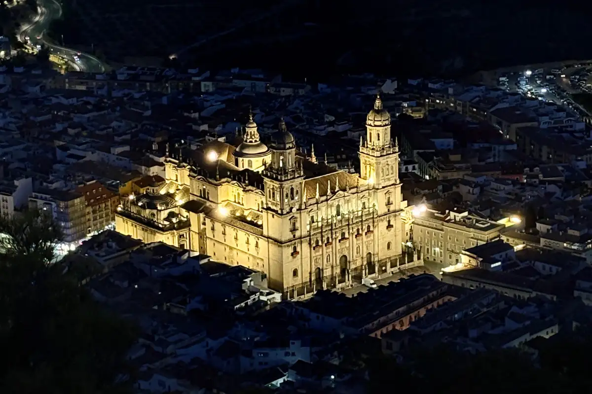 Jaén Cathedral illuminated at night, viewed from the hillside above the city