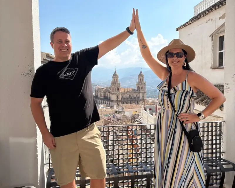 Couple on a rooftop with views of Jaén Cathedral and the surrounding city