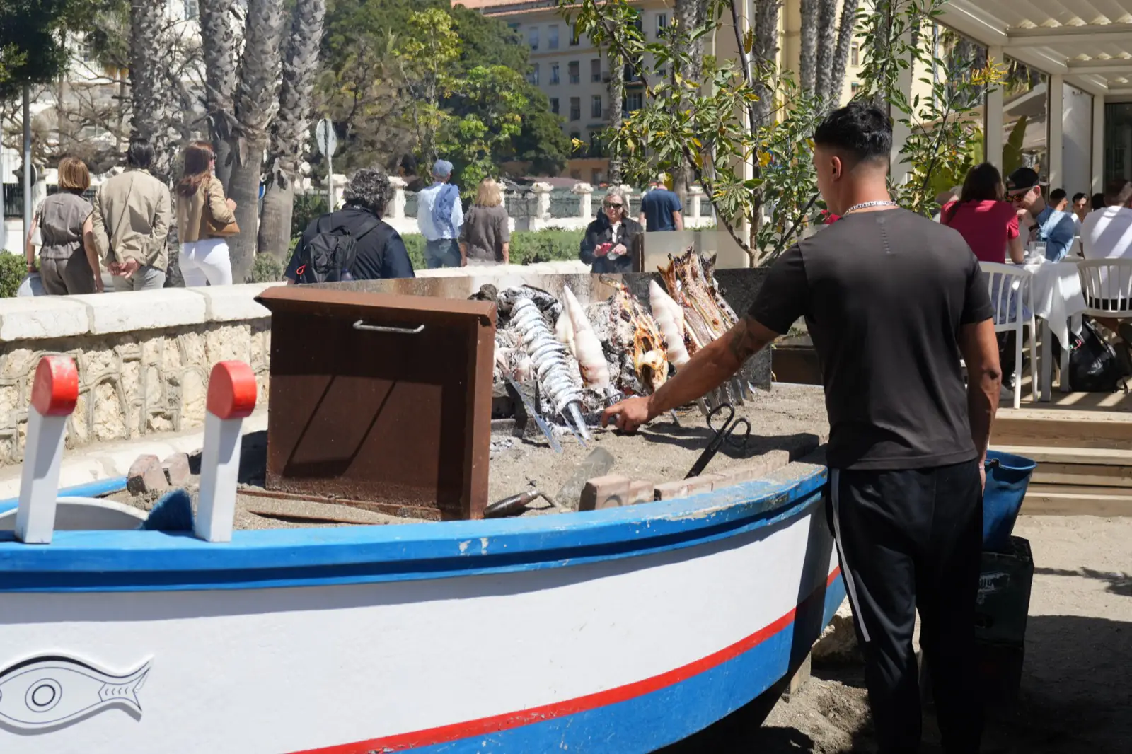 Sardine skewers on a boat at Malagueta beach.