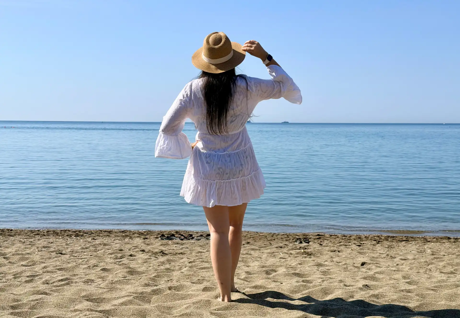 Woman relaxing on a Málaga city beach on a sunny June day