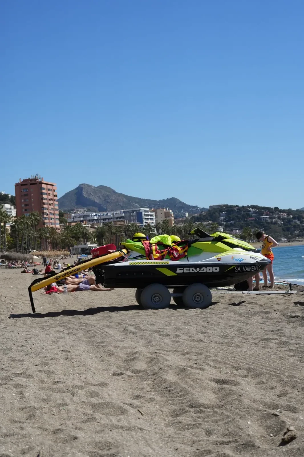 Jet ski cutting through the water off Malagueta beach on a summer day