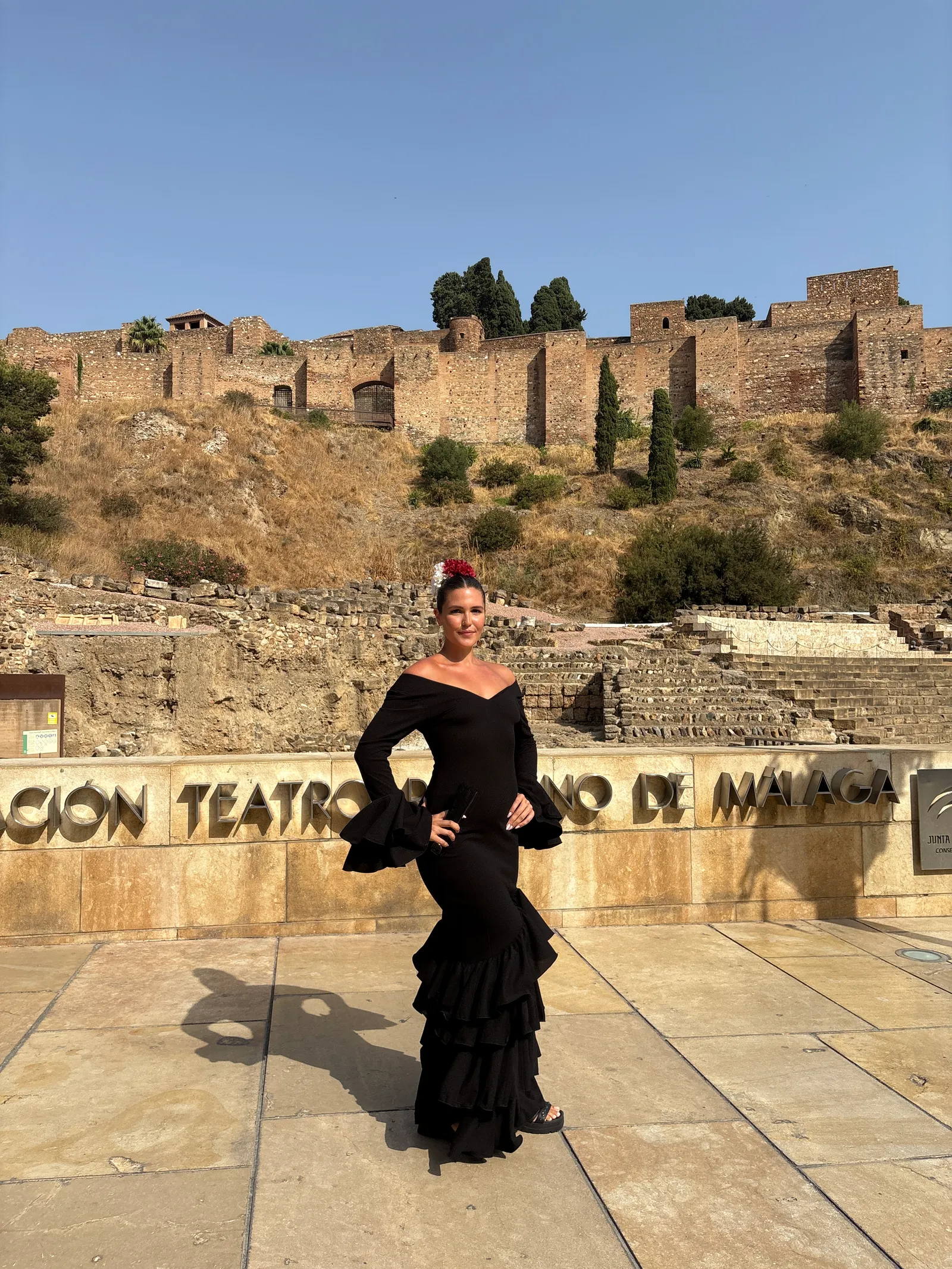 Heidi wearing a traditional flamenco dress with ruffled skirt in Malaga