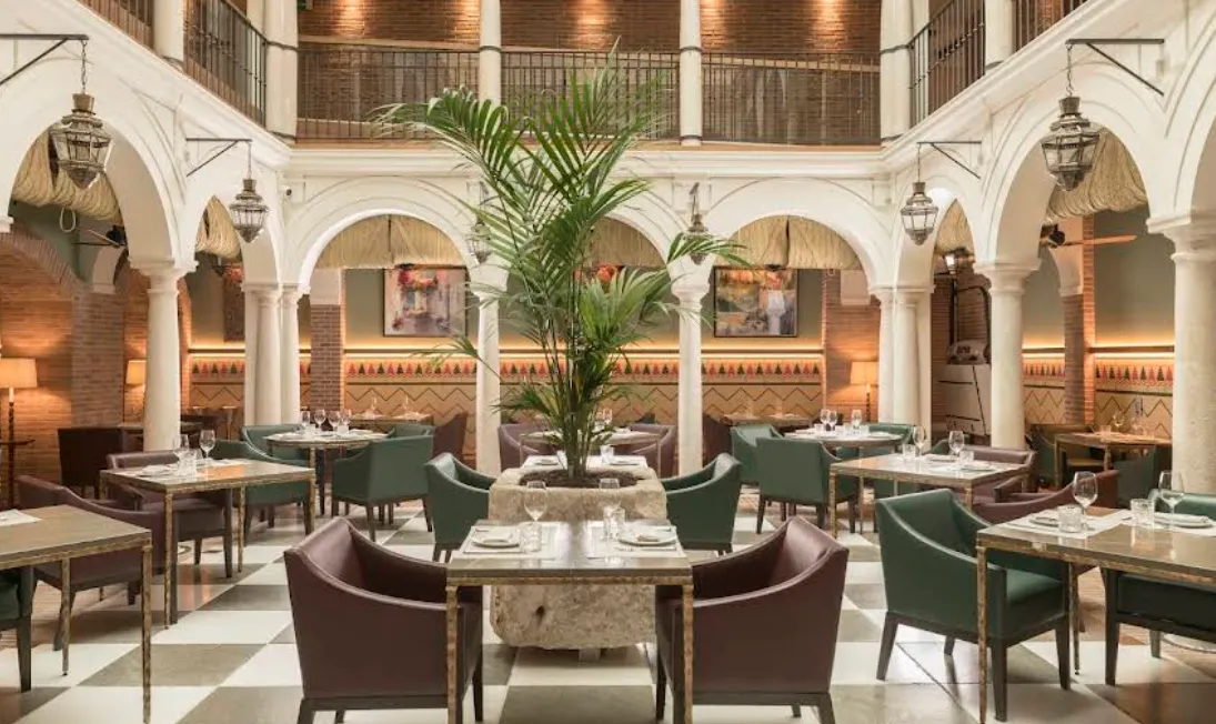 Tiled courtyard with columns inside Palacio Solecio hotel in Malaga's old town