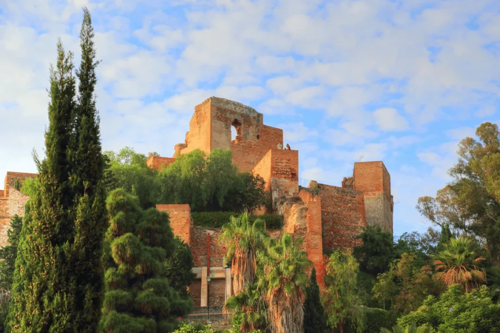 The Alcazaba fortress and old town rooftops in Málaga with the port beyond