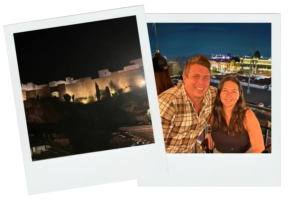 Rooftop bar with night views of the illuminated Alcazaba fortress in Malaga