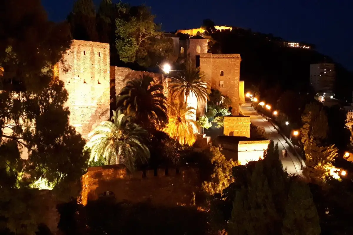 Alcazaba fortress walls in Malaga lit up at night
